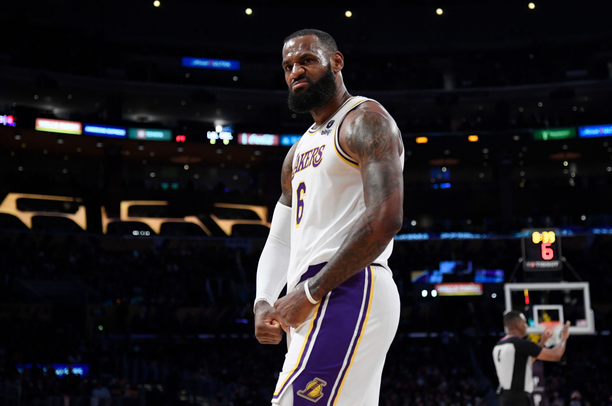 Lakers star LeBron James reacts after scoring a basket and drawing a foul during the first half.
