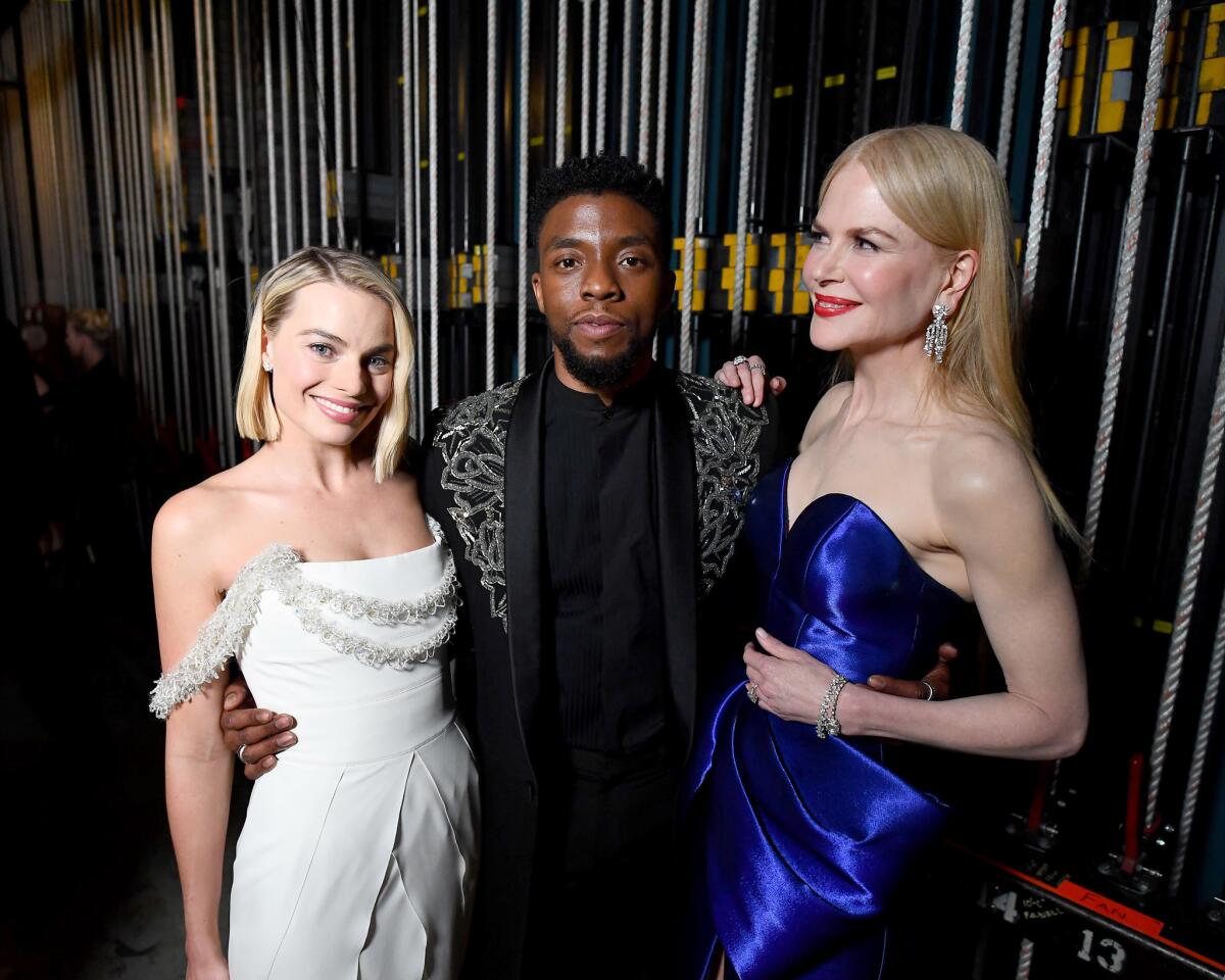 Margot Robbie, left, Chadwick Boseman and Nicole Kidman attends the 90th Academy Awards.