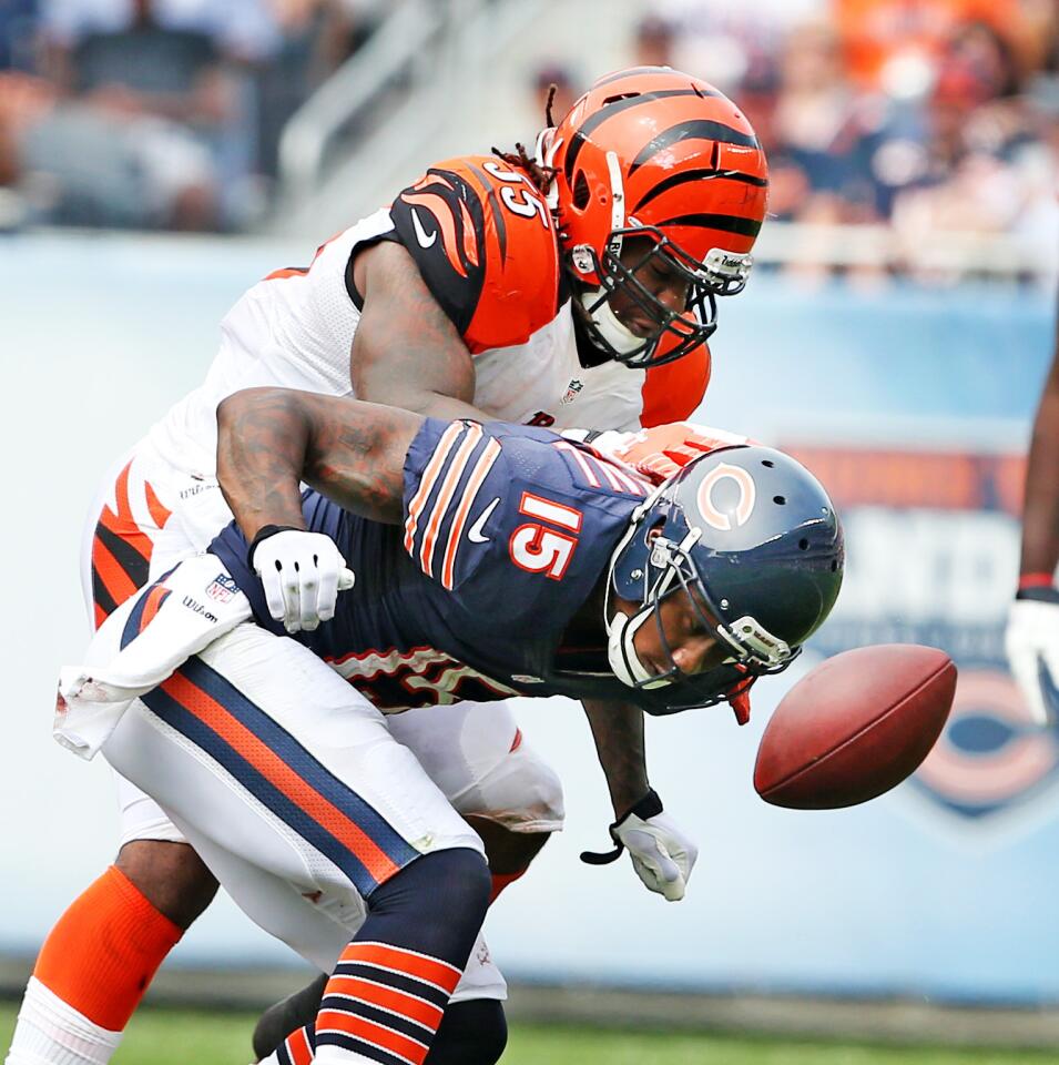 Chicago Bears wide receiver Brandon Marshall (15) , covered by Cincinnati Bengals outside linebacker Vontaze Burfict (55), fails to catch a pass during the first half of their game at Soldier Field, in Chicago, on Sunday.