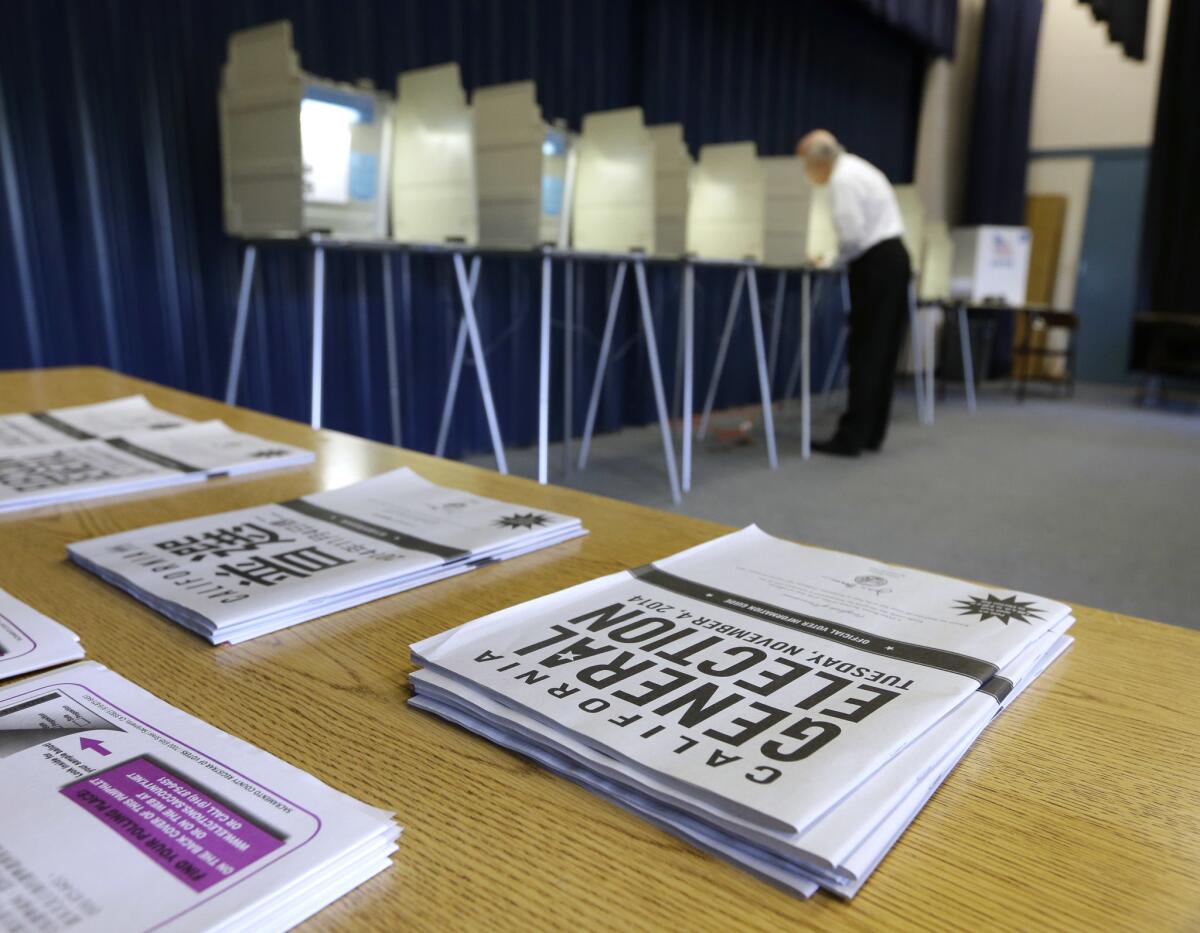 A man marks his ballot while voting in Elk Grove, Calif. in November of 2014.