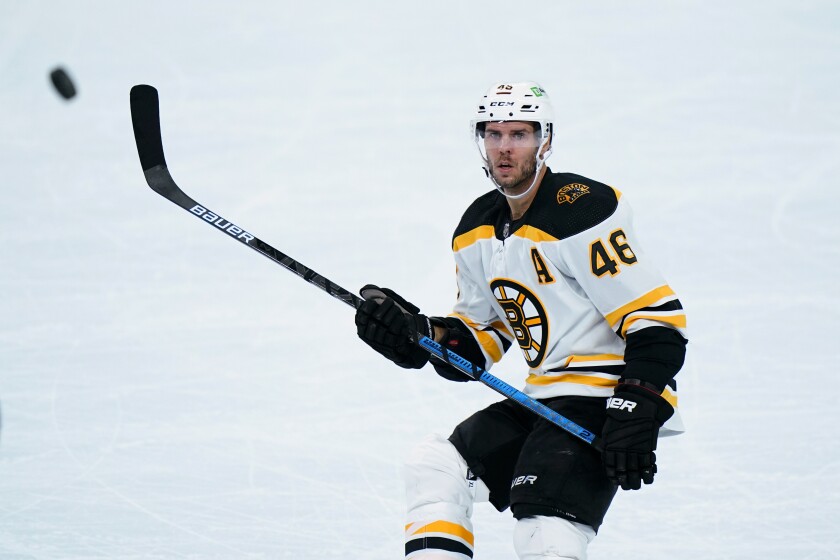 FILE- Boston Bruins' David Krejci plays during an NHL hockey game against the Philadelphia Flyers, Wednesday, Feb. 3, 2021, in Philadelphia. Czech Republic's Krejci is among the players to watch at the 2022 Beijing Olympics without an NHL presence. (AP Photo/Matt Slocum, File)