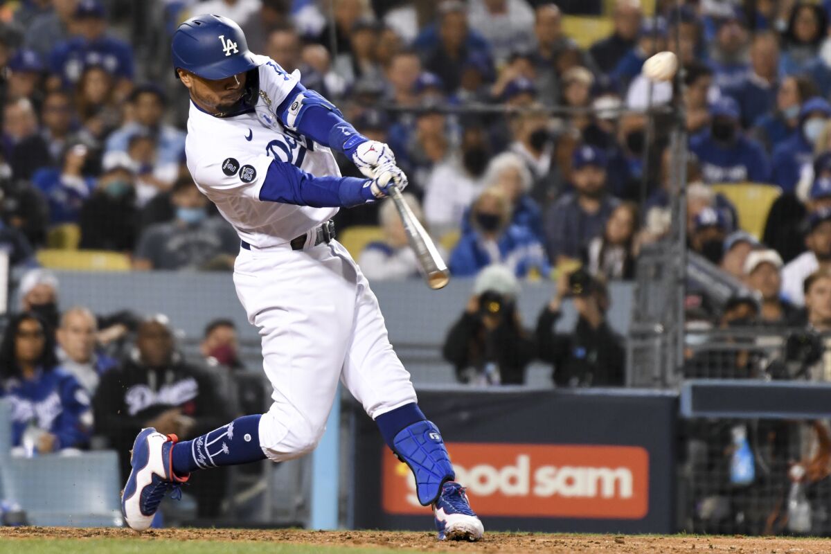 Mookie Betts hits a two-run home run during the fourth inning of the Dodgers' 7-2 win over the San Francisco Giants.