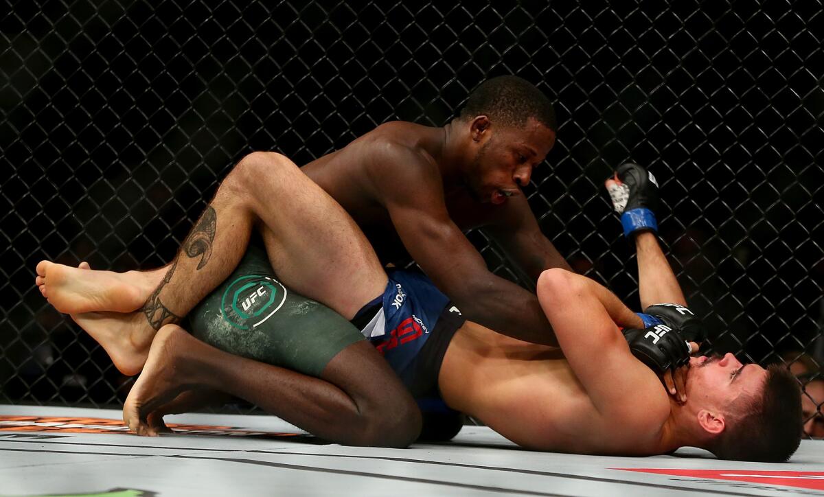 Randy Brown, who would win by decision, takes down Mickey Gall during their welterweight bout at UFC 217.