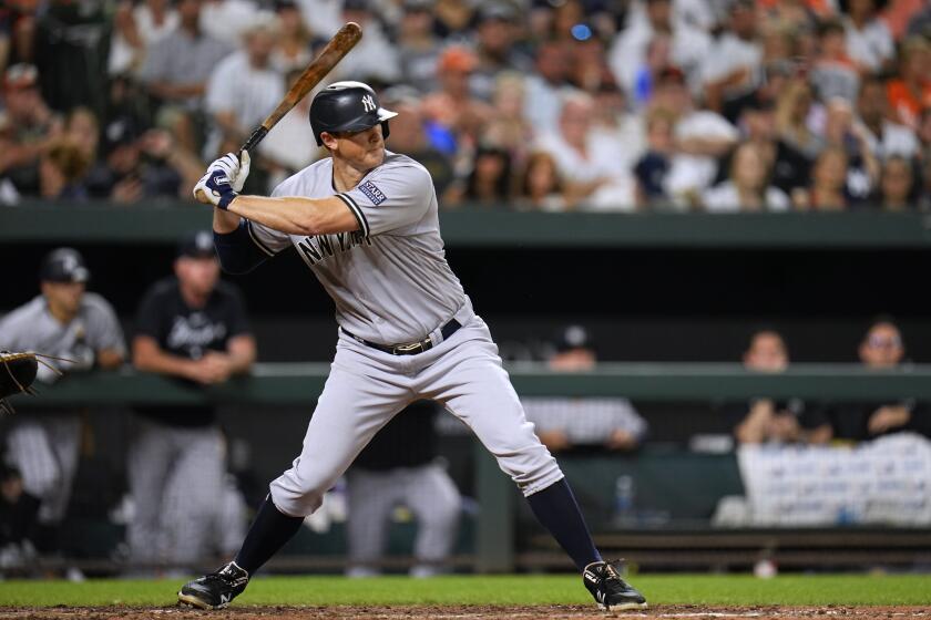 FILE - New York Yankees' DJ LeMahieu bats against the Baltimore Orioles during the sixth inning of a baseball game July 29, 2023, in Baltimore. The Yankees delayed the start of LeMahieu's minor league injury rehabilitation assignment after an MRI showed the fracture in his right foot has not fully healed. The 35-year-old, a two-time batting champion, has been sidelined since fouling a ball off the foot during a spring training game March 16. (AP Photo/Julio Cortez,, File)