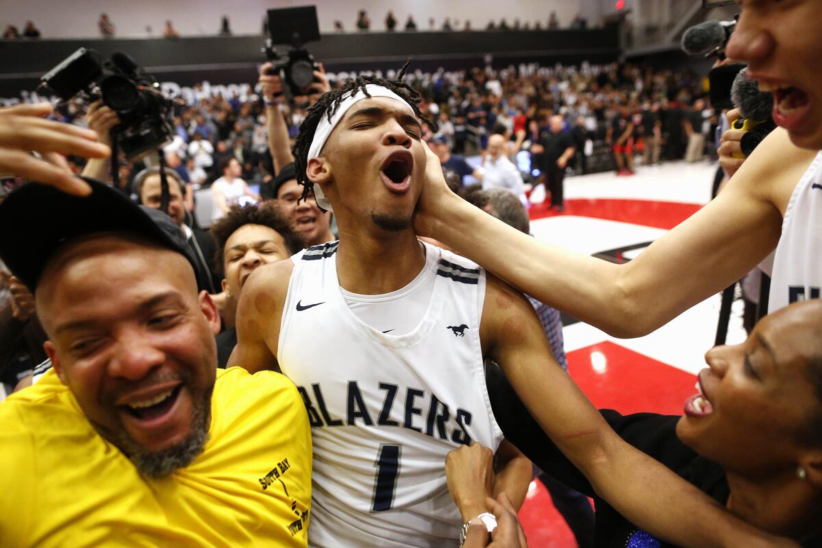 In 2020, Ziaire Williams (1) of Sierra Canyon celebrates with his father Ziaire Williams Sr. and mother Marquita Williams.