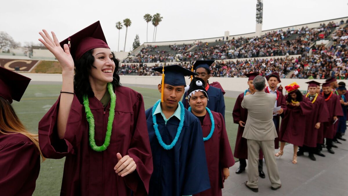 More L.A. Unified students, like Metropolitan High School's Yesenia Ceballos, 18, left, graduated this year, but a persisting challenge is to get them to graduate from college.