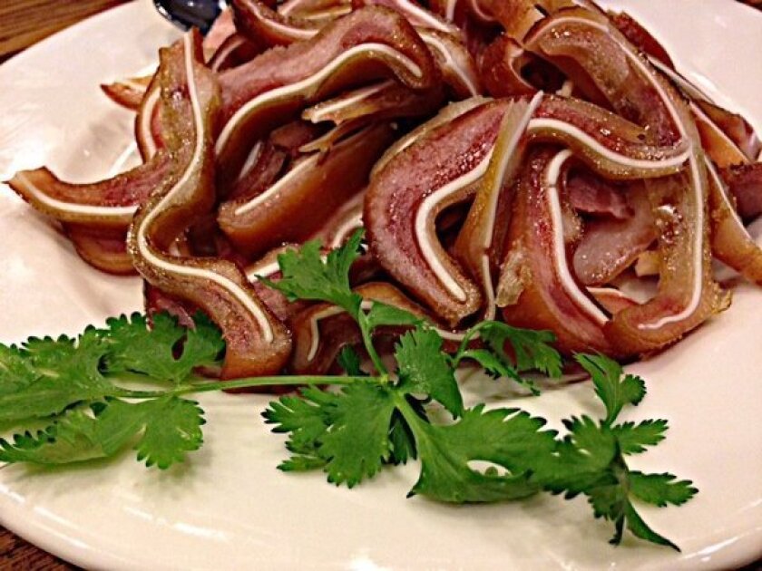Chewy sliced pig's ears smoked like Sichuan bacon.