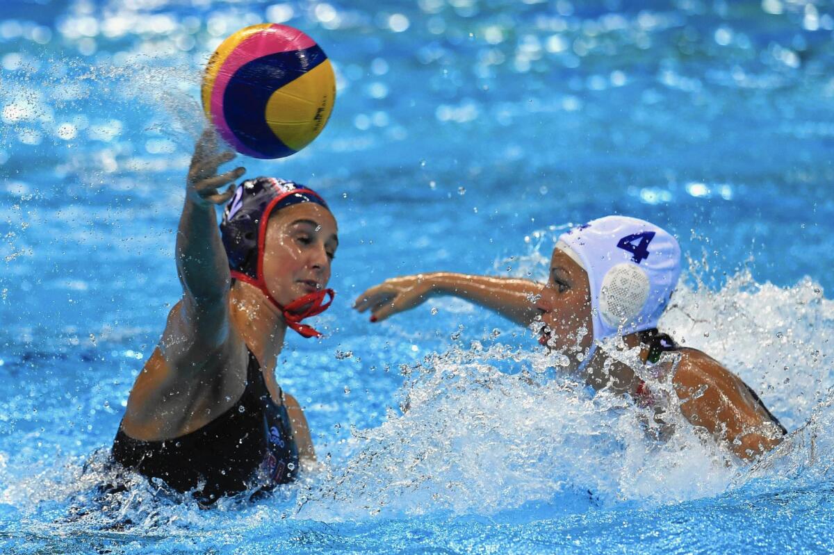 Maddie Musselman, left, a former Corona del Mar High standout, scored two goals against Hungary in a U.S. women’s water polo semifinal of the Rio Olympics.