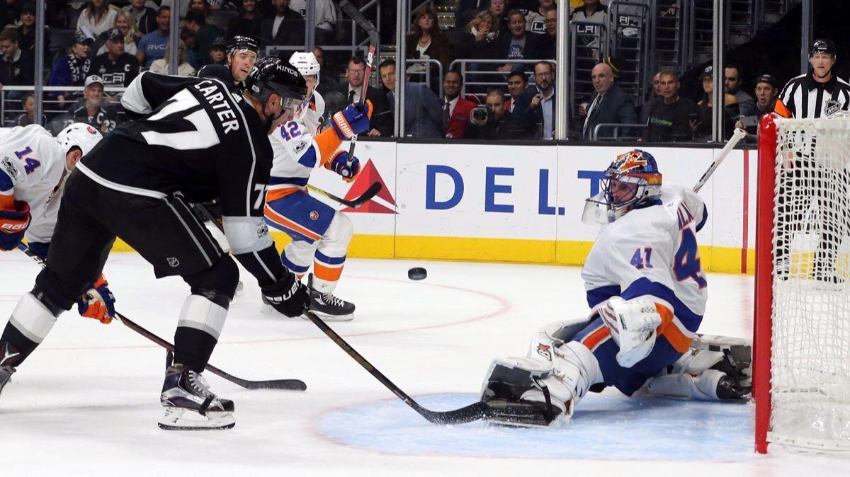 New York Islanders goalie Jaroslav Halak (41) defends at Kings center Jeff Carter (77) moves in in the second period on Sunday.