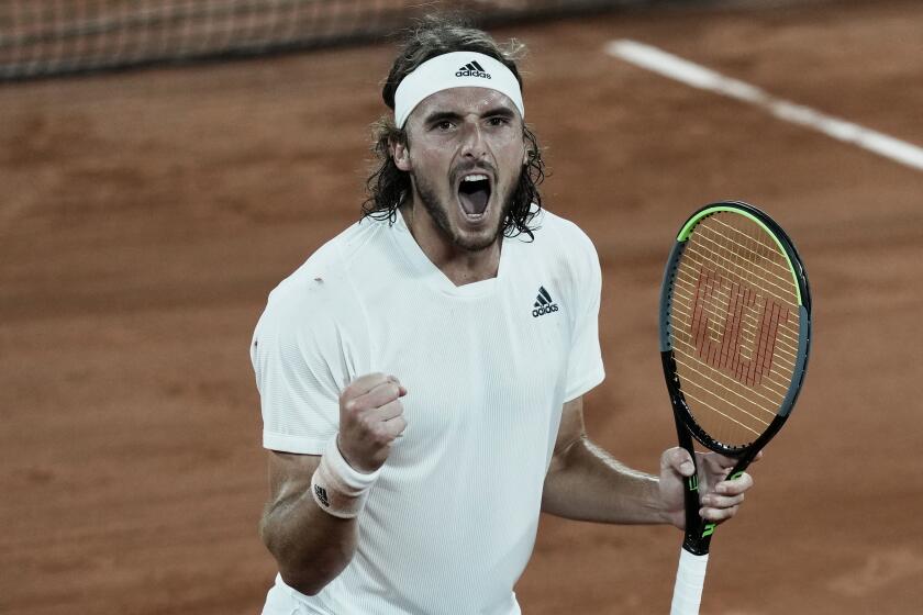 Stefanos Tsitsipas of Greece celebrates after defeating Russia's Daniil Medvedev during their quarterfinal match of the French Open tennis tournament at the Roland Garros stadium Tuesday, June 8, 2021 in Paris. (AP Photo/Thibault Camus)