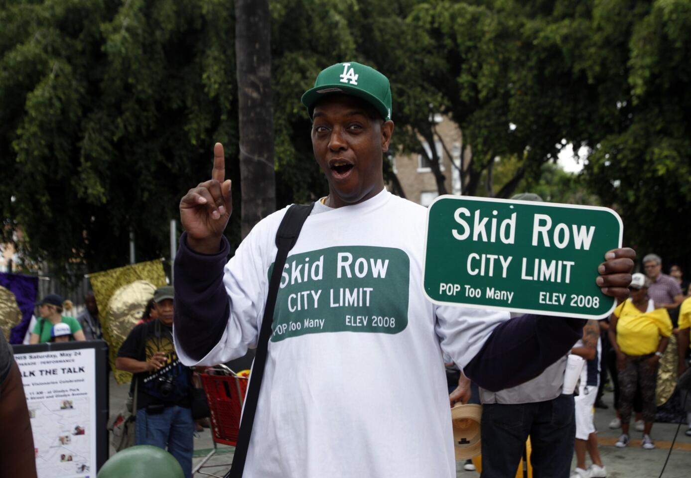 Downtown L.A. Neighborhood Council member General Jeff Page joins in the celebration of skid row and its leaders during the annual Walk the Talk parade.