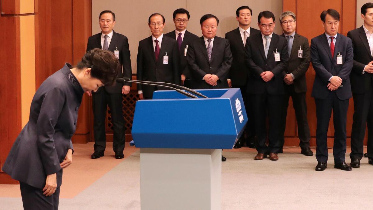 South Korean President Park Geun-hye bows after a public apology in Seoul.