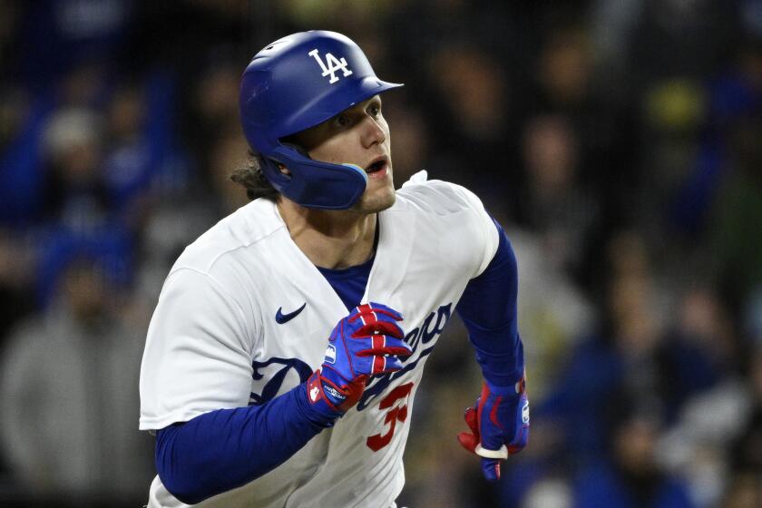 Los Angeles Dodgers' James Outman runs to first after hitting an RBI triple during the fifth inning of a baseball game against the Colorado Rockies Monday, April 3, 2023, in Los Angeles. (AP Photo/Mark J. Terrill)