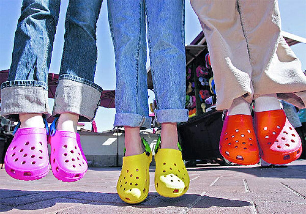Pink, yellow and red Crocs