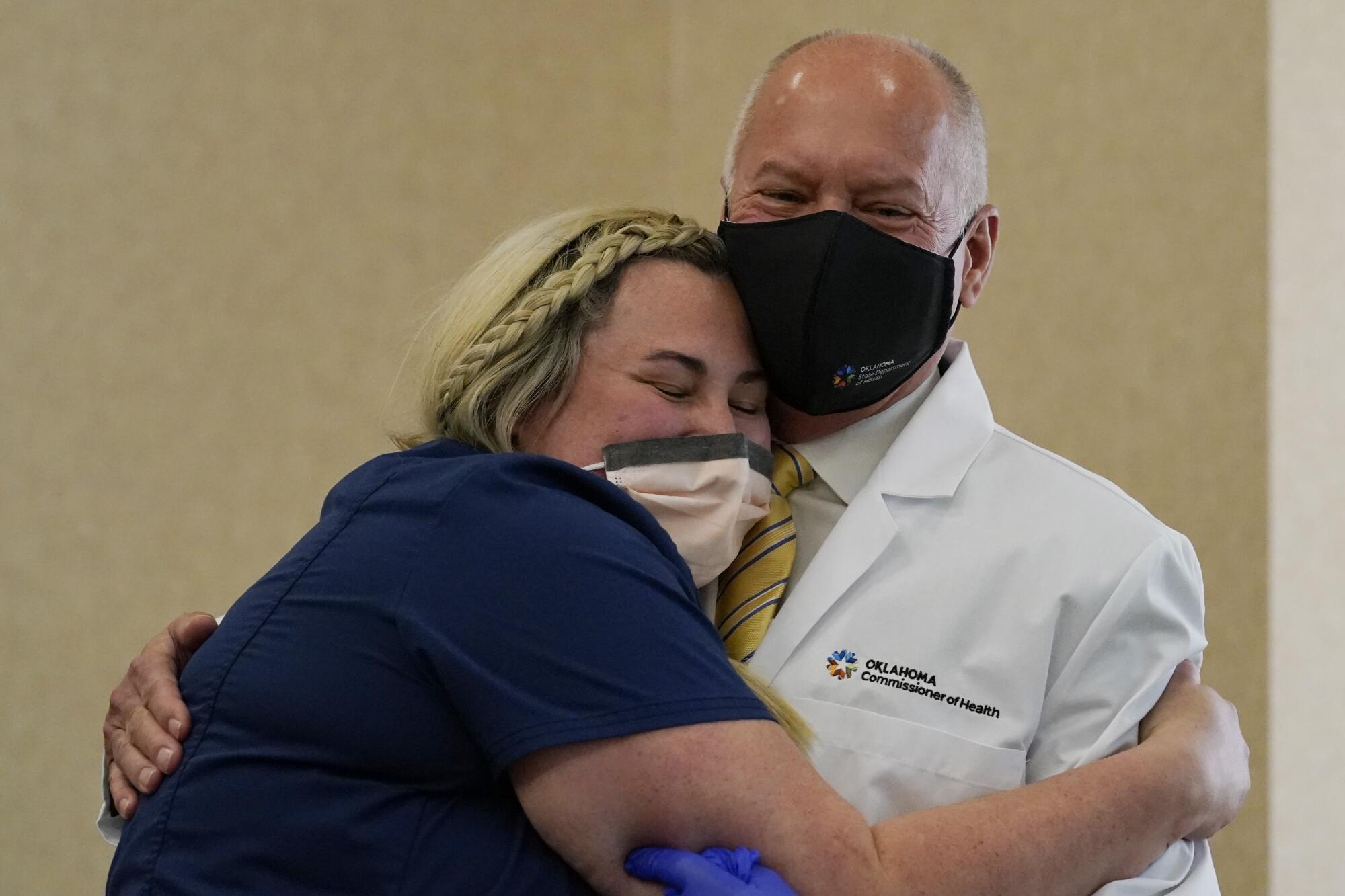 Nurse Hannah White hugs Dr. Lance Frye