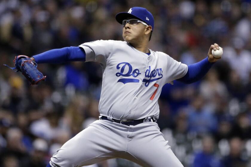 Los Angeles Dodgers' Julio Urias pitches during the first inning of the baseball team's game against the Milwaukee Brewers on Thursday, April 18, 2019, in Milwaukee. (AP Photo/Aaron Gash)