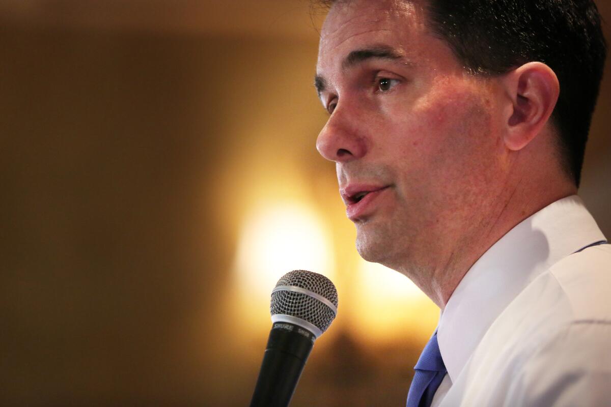 Republican presidential candidate Wisconsin Gov. Scott Walker delivers keynote remarks at the DuPage County GOP Summer Reception, Thursday, Aug. 13, 2015 at Carlucci's Restaurant in Downers Grove, Ill. (Anthony Souffle/Chicago Tribune via AP) MANDATORY CREDIT, CHICAGO SUN-TIMES OUT, DAILY HERALD OUT, NORTHWEST HERALD OUT, DAILY CHRONICLE OUT, THE HERALD-NEWS OUT, THE TIMES OF NORTHWEST INDIANA OUT, TV OUT, MAGS OUT, NO SALES