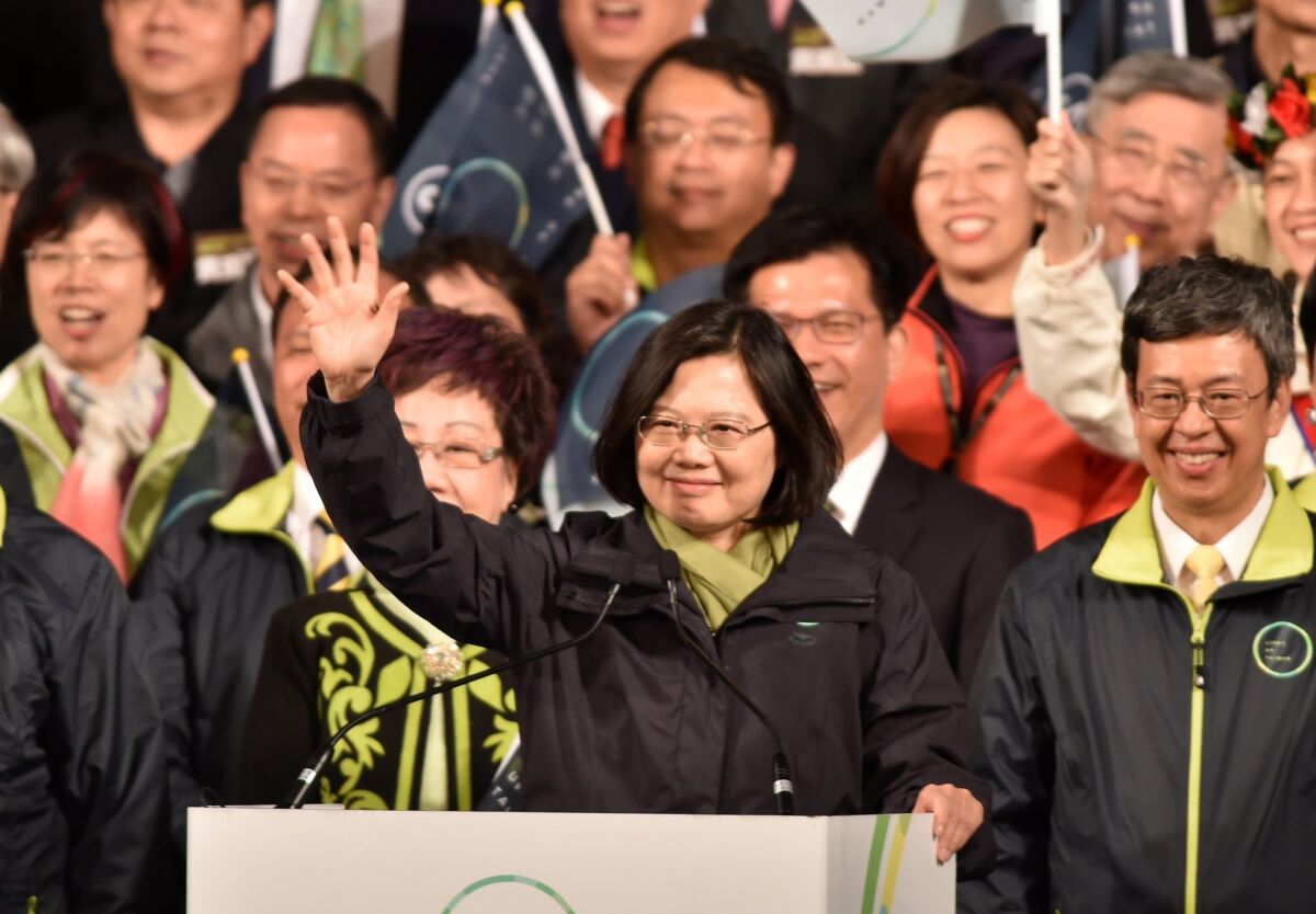 Tsai Ing-wen waves to supporters after being elected as Taiwan's first female president on Saturday.
