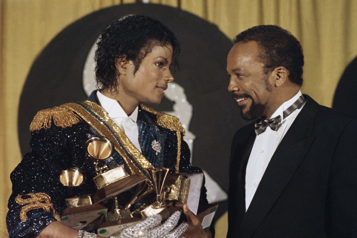 Michael Jackson, left, and Quincy Jones at the 1984 Grammy Awards at Shrine Auditorium in Los Angeles.