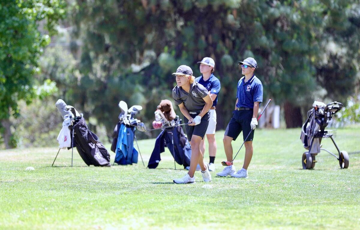 Joseph Wong follows the flight of the ball after his tee shot on No. 17.