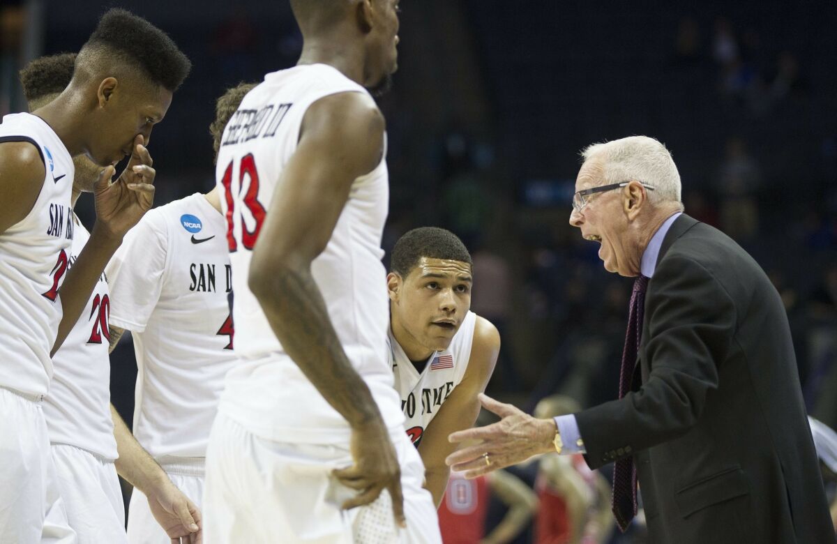 SDSU vs St. John's Mens Basketball in the second round of the NCAA Mens Basketball Tournament. Head Coach Steve Fisher gathers his team in the second half.
