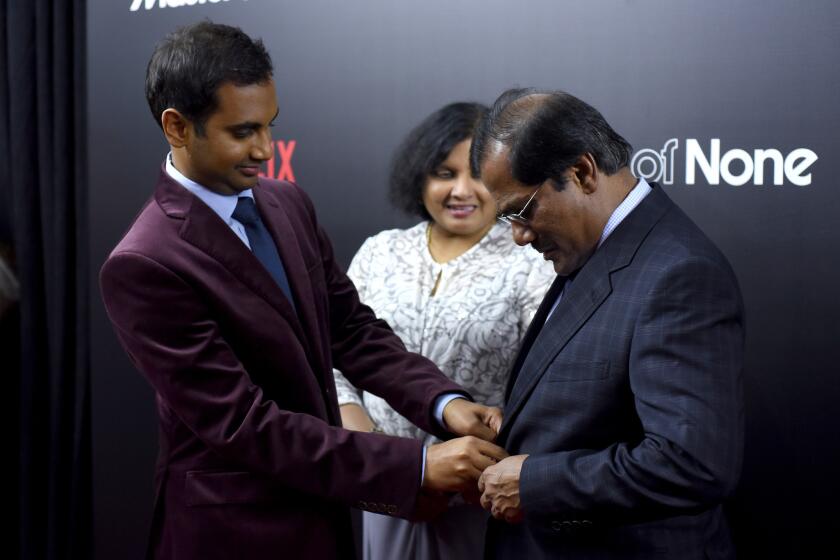 Aziz Ansari, left, and his parents, Fatima Ansari and Shoukath Ansari, attend the "Master of None" premiere in New York on Nov. 5.