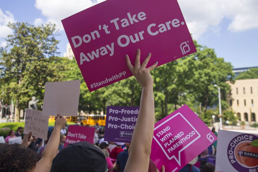 FILE - In this Tuesday, May 7, 2019, file photo, protesters rally outside of the Georgia State Capitol following the signing of HB 481, in Atlanta. Georgia Governor Brian Kemp signed legislation on Tuesday banning abortions once a fetal heartbeat can be detected. (Alyssa Pointer/Atlanta Journal-Constitution via AP, File)