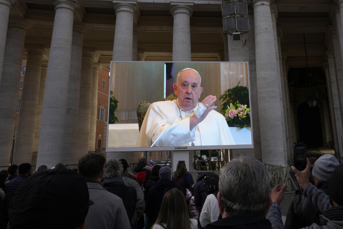 Pope Francis projected onto giant screen