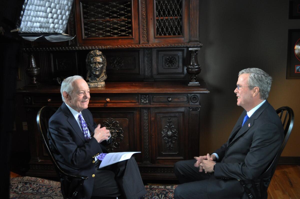 CBS News' Bob Schieffer interviews former Florida Gov. Jeb Bush in Nashville on Saturday. Bush said that criticizing his brother, former President George W. Bush, was difficult for him.