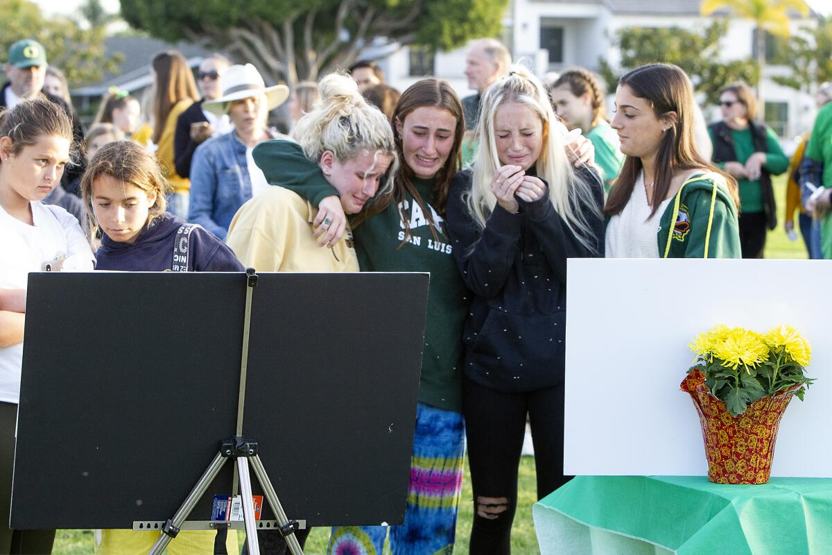 Teenagers mourn Alyssa Altobelli during a candlelight vigil and memorial ceremony Thursday evening at Mariners Park in Newport Beach. Alyssa, an eighth-grader at Newport's Ensign Intermediate School, was among the nine people killed in a helicopter crash Sunday in Calabasas.