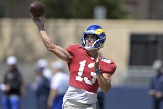 Los Angeles Rams quarterback Stetson Bennett throws a pass during a joint practice.