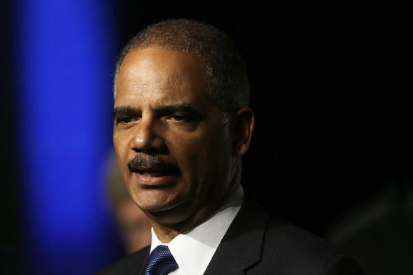 Atty. Gen. Eric Holder plans to challenge a new voter ID law in Texas, saying it is discriminatory.