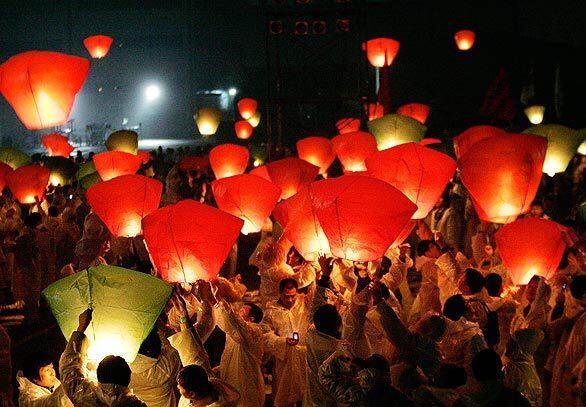 Workers of financially troubled Ssangyong Motor Co., and its Chinese majority shareholder Shanghai Automotive Industry Corp., release paper lanterns during a rally Wednesday against the management's restructuring plan at its plant in Pyeongtaek, South Korea. The labor union of the ailing Korean automaker said Tuesday that its members had overwhelmingly approved a proposed strike against massive layoffs announced by the automaker as part of its restructuring efforts.