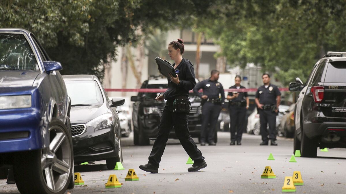 Los Angeles police investigators work at the scene of a 2017 fatal shooting in Hollywood.