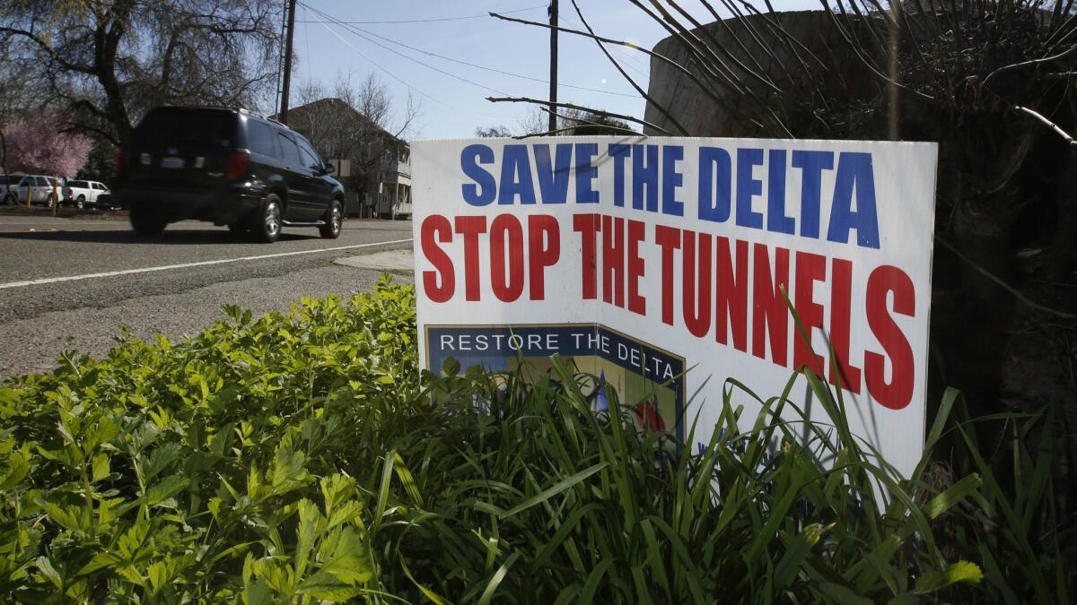 A sign opposing a proposed tunnel plan to ship water through the Sacramento-San Joaquin River Delta to Southern California is displayed near Freeport, Calif., in 2016.