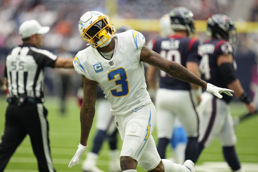 Los Angeles Chargers safety Derwin James Jr. (3) celebrates a stop against the Houston Texans during the second half of an NFL football game Sunday, Oct. 2, 2022, in Houston. (AP Photo/Eric Christian Smith)