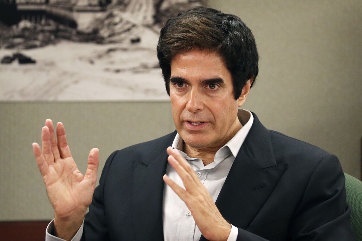 FILE - llusionist David Copperfield appears in court in Las Vegas on April 24, 2018. The Nevada Supreme Court has upheld a jury’s findings that illusionist David Copperfield and the MGM Grand weren't financially responsible for a British tourist’s injuries during a Las Vegas Strip show in 2013. (AP Photo/John Locher, File)