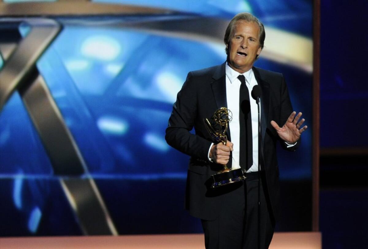 Jeff Daniels accepts the Emmy Award for outstanding lead actor in a drama series for his role on "The Newsroom" during ceremonies at the Nokia Theatre