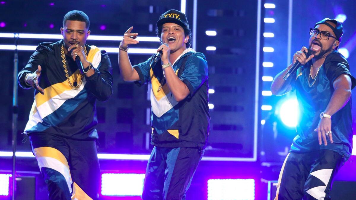 Bruno Mars, center, performs "24K Magic."