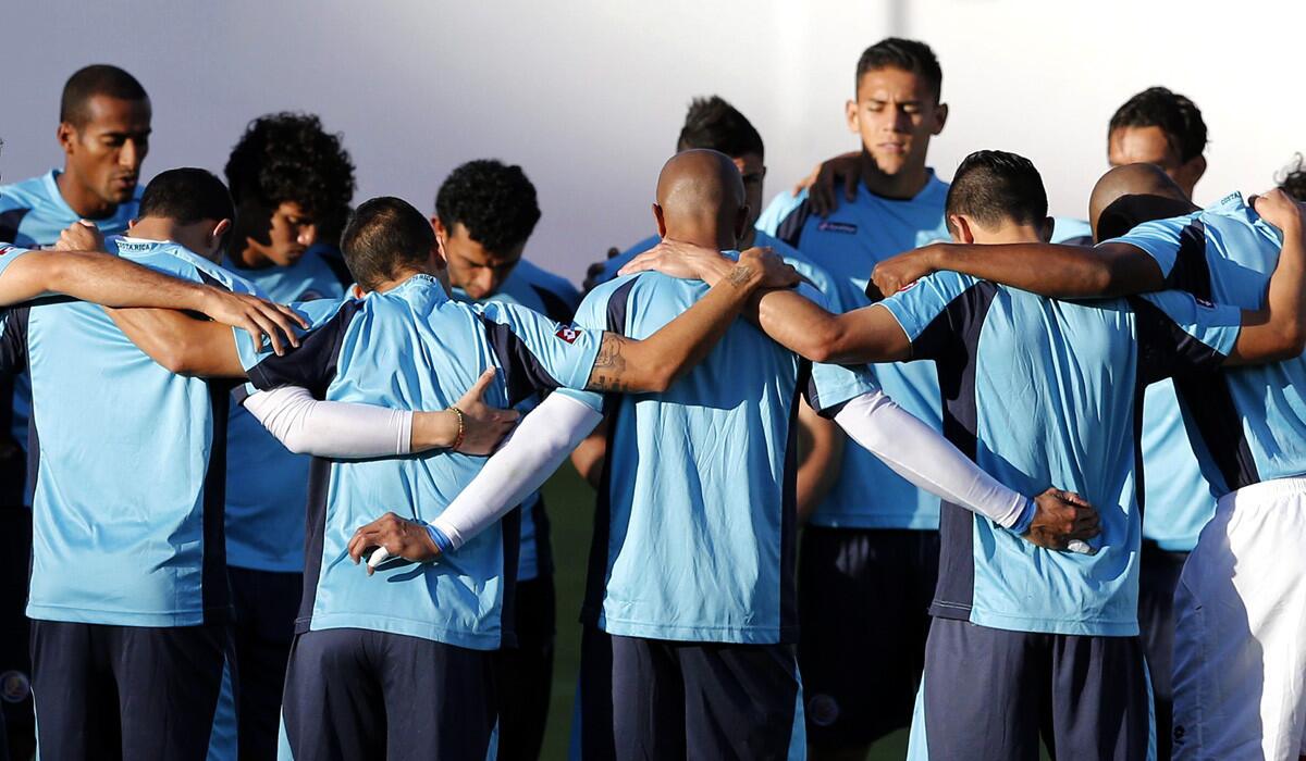 Costa Rica players huddle together during a training session at Manoel Barrads Stadium in Salvador, Brazil, on Friday as they prepare to play the Netherlands in the quarterfinals of the World Cup.
