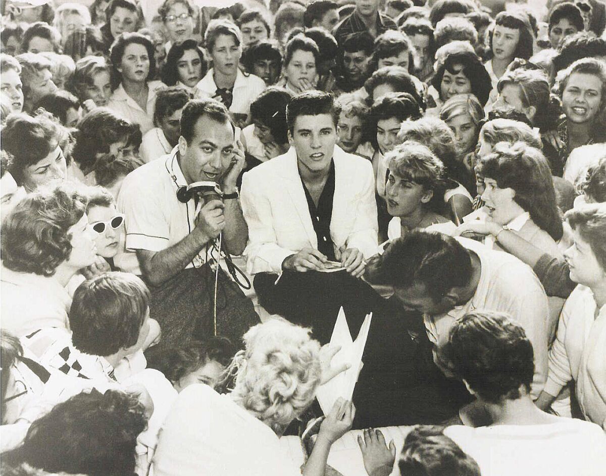 Art Laboe and Ricky Nelson at the Scrivner's drive-in in Hollywood in 1957. 