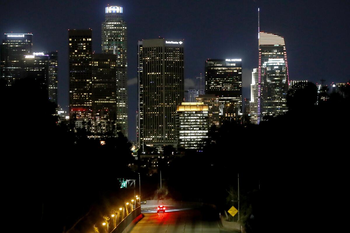 A lone car travels on the Pasadena Freeway in Los Angeles. 