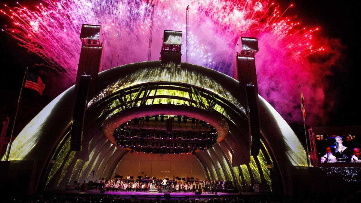 Fireworks light up the sky as singer Katy Perry performs and Gustavo Dudamel conducts the LA Philharmonic 100th anniversary concert.