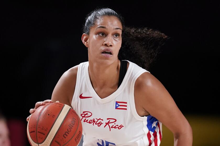 Puerto Rico's Isalys Quinones plays against China during a women's basketball.