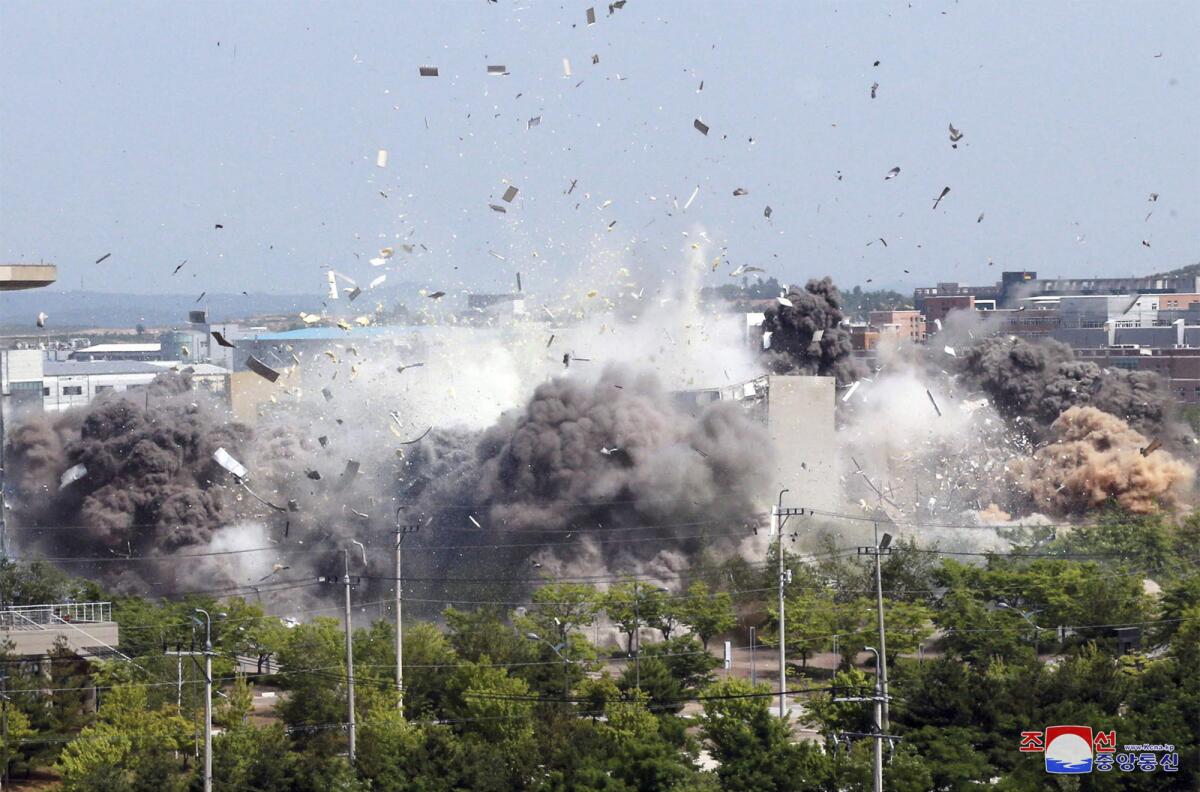 This photo provided by the North Korean government shows the explosion of an inter-Korean liaison office building on Tuesday.