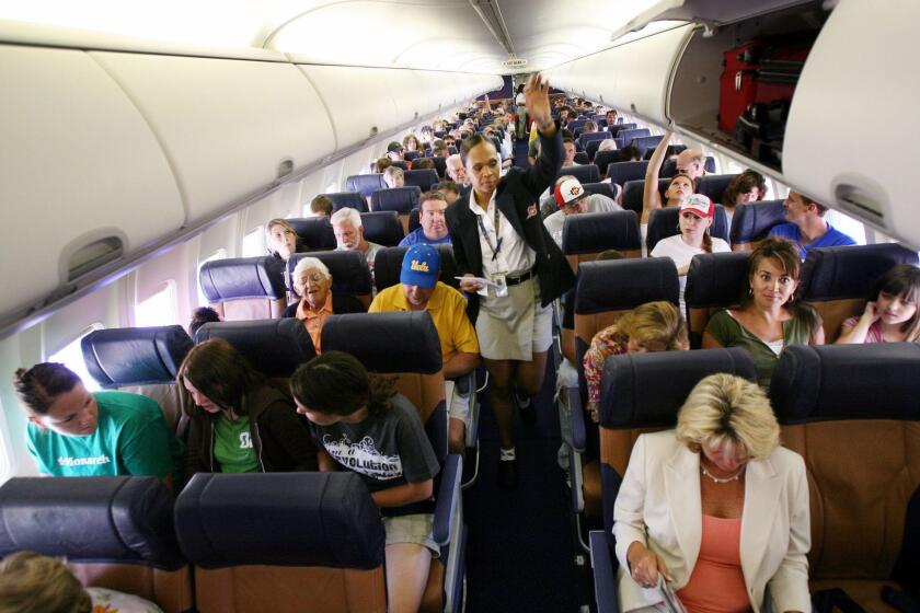 SAN DIEGO, CA - JULY 10: Passengers sit in their assigned seats before take-off July 10, 2006 at San Diego's Lindburgh Field Airport in San Diego, California. Contrary to the airlines's traditional practice, Southwest is experimenting with a new passenger seating system which made a trial run from San Diego to Phoenix. (Photo by Sandy Huffaker/Getty Images)