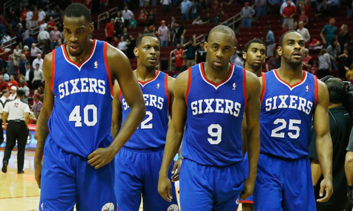 Philadelphia 76ers teammates (from left to right) Jarvis Varnado, James Nunnally, James Anderson and Elliot Williams walk off the court following a 120-98 loss to the Houston Rockets on Thursday.