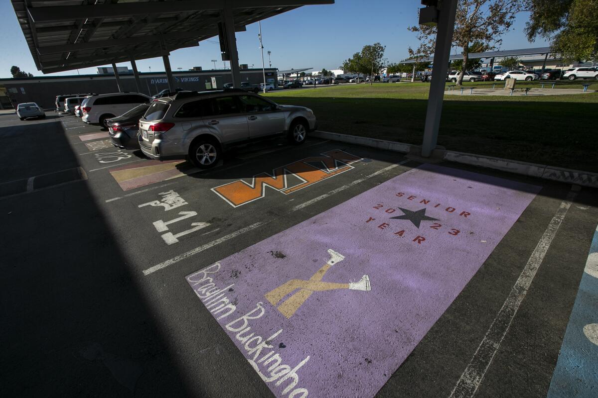 Painted parking spaces appear in front of Marina High School on Thursday in Huntington Beach.