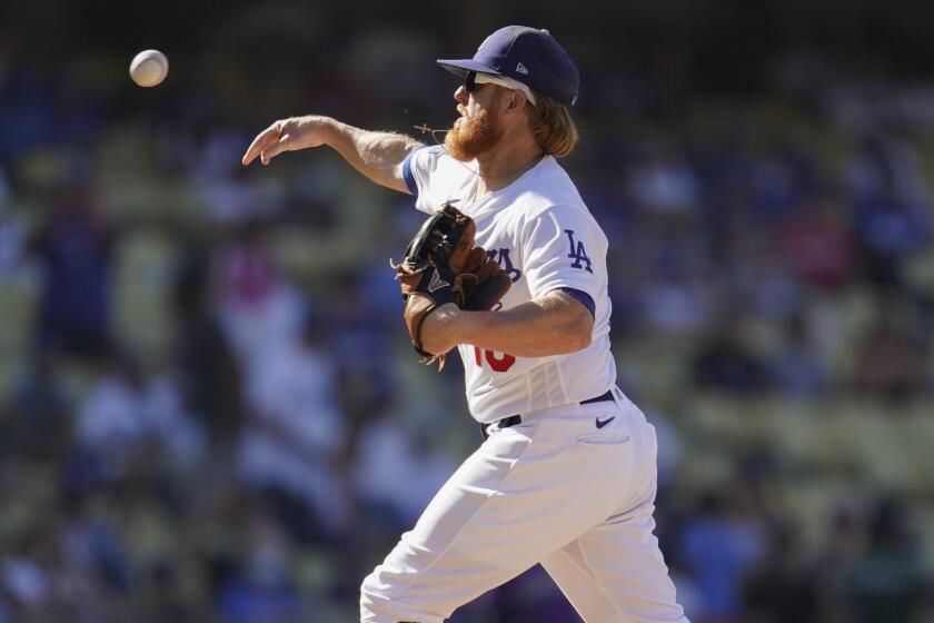Los Angeles Dodgers relief pitcher Justin Turner throws during the ninth inning.