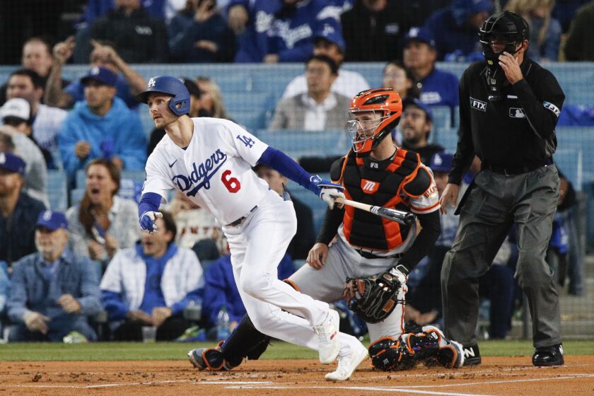 Los Angeles, CA - October 12: Los Angeles Dodgers' Trea Turner follows through on a swing for an RBI double.